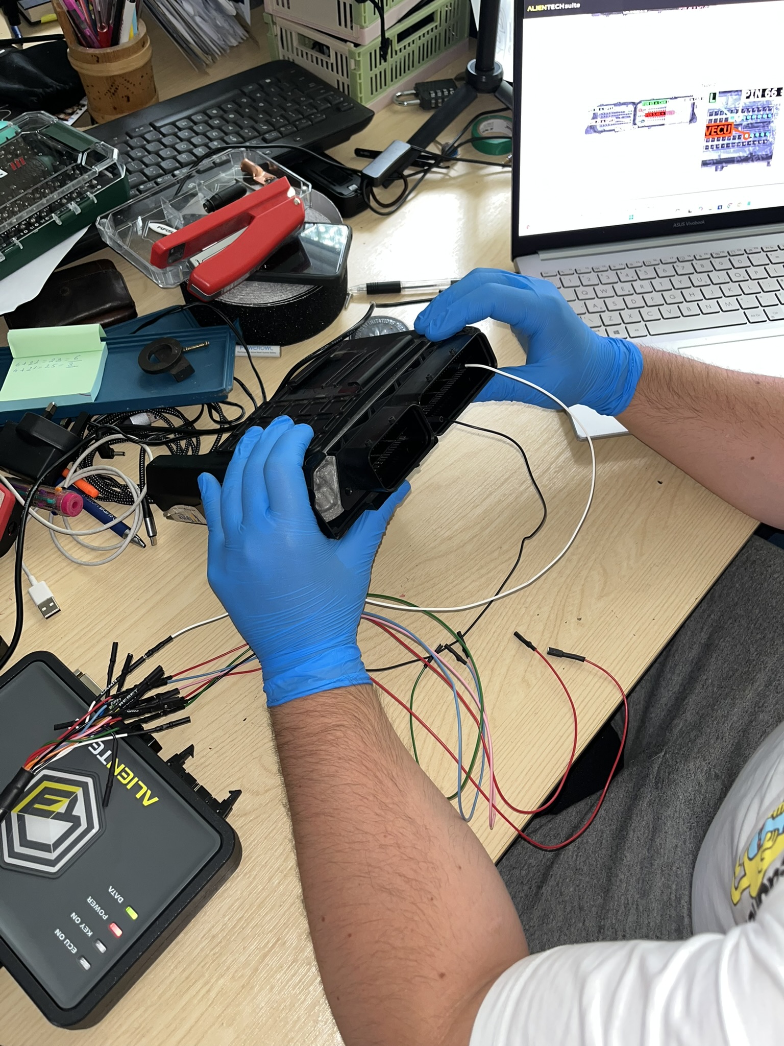 Technician making ECU connections for Boot Mode programming