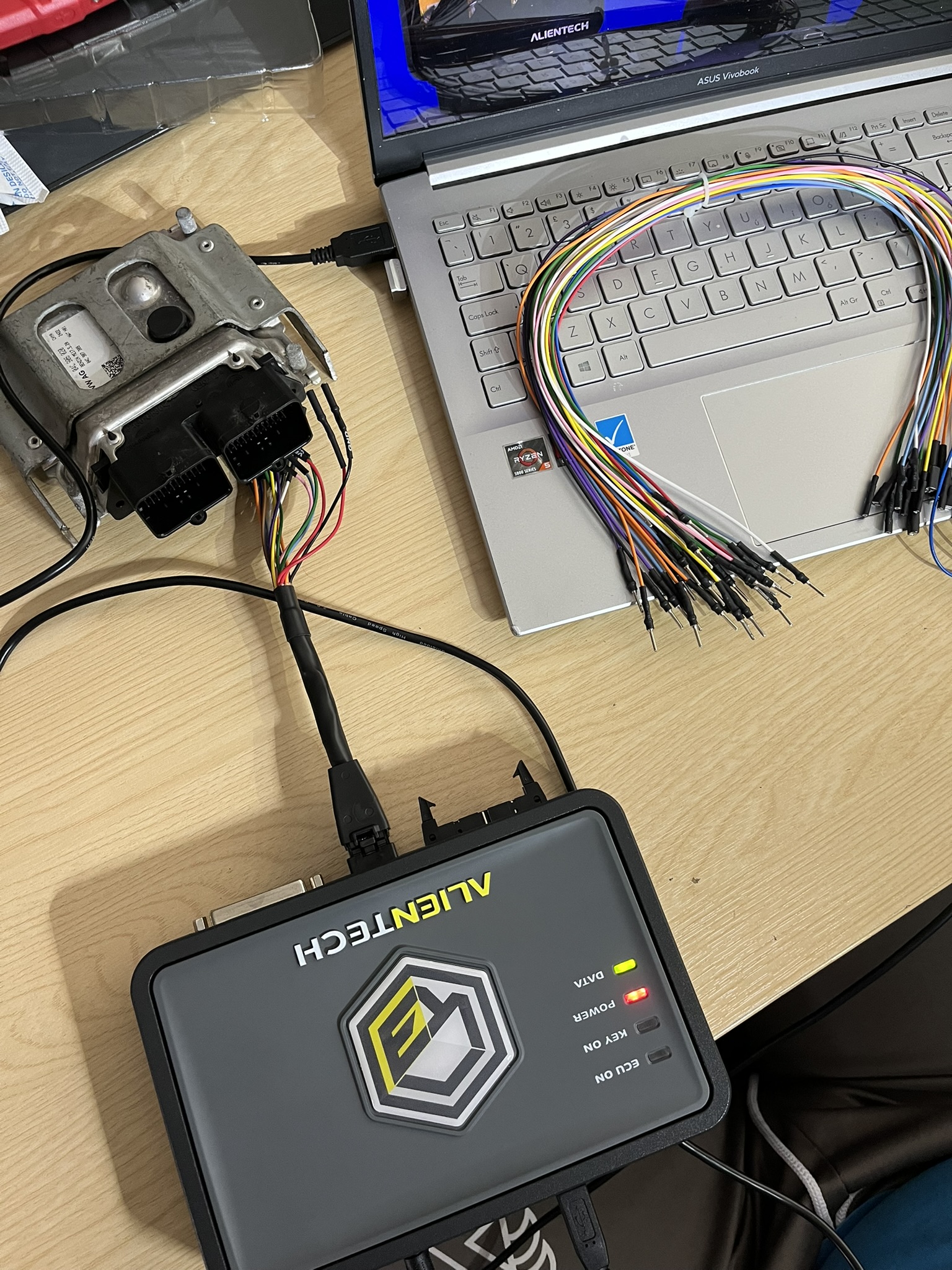 KESS3 connected to an ECU and laptop with a technical wiring harness