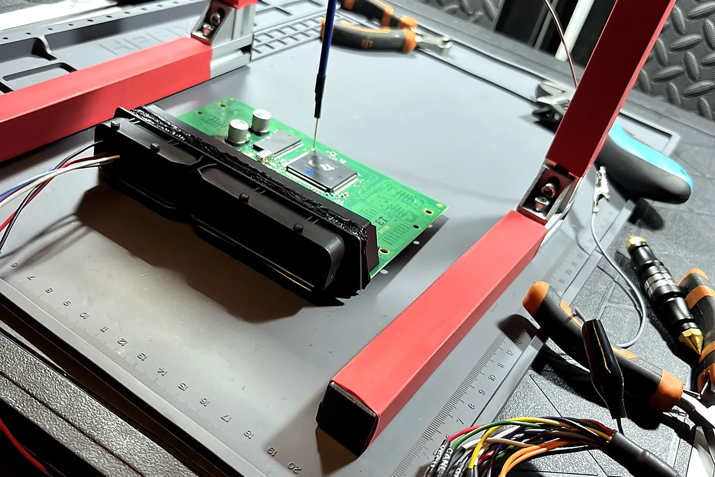 ECU secured on a professional programming frame
